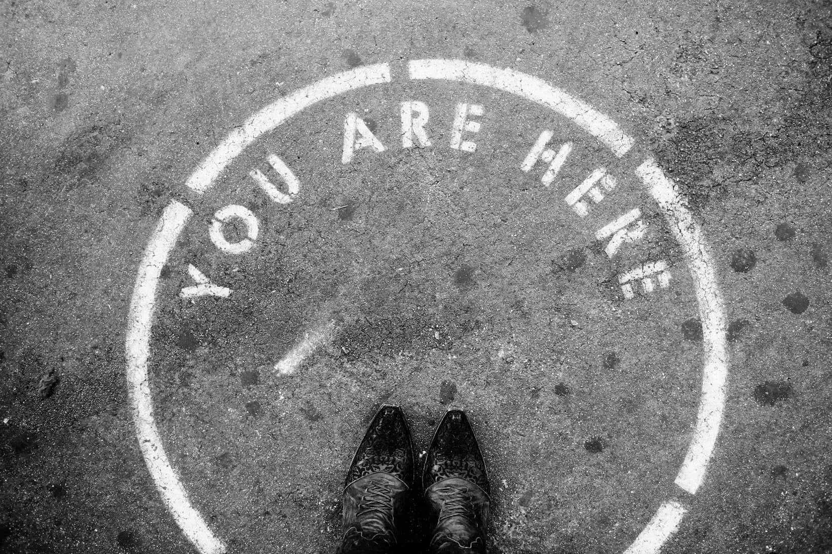 "start here" painted on ground